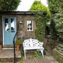 A Grade II listed country cottage residence dating back to the early 17th Century has original features, a private garden and far reaching views.