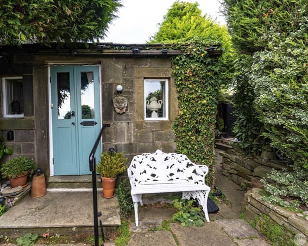 A Grade II listed country cottage residence dating back to the early 17th Century has original features, a private garden and far reaching views.