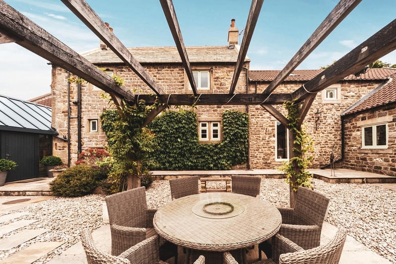 The sunken stone flagged terrace is perfectly private making it an ideal place for relaxing in the sun.
