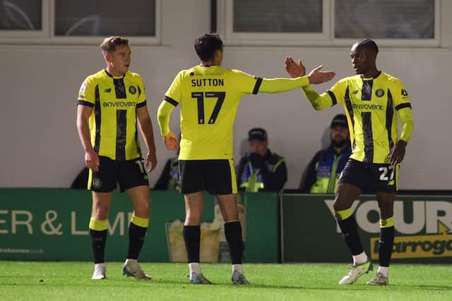 Harrogate Town debutant Eno Nto, right, is congratulated after finding the net against Blackpool.