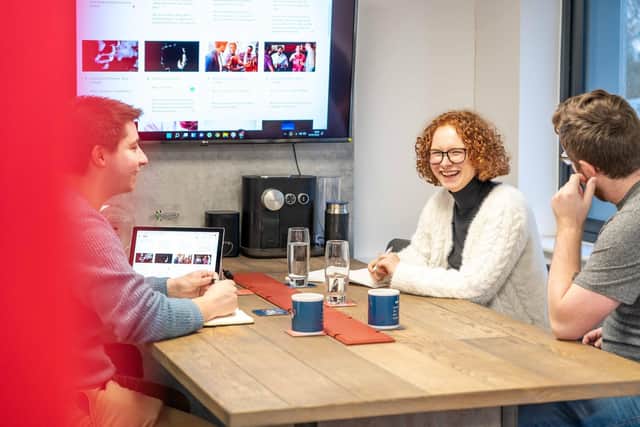 In the running for British entrepreneurship award - Harrogate's Adam Chandler, owner of Reel Film, right, at a team meeting in Wetherby. (Picture contributed)