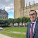 Tom Gordon MP stood outside the Houses of Parliament