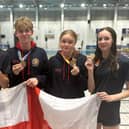 Proud member of the England team - Harrogate Grammar School's Gabe Shepherd, second from left, is now a world champion in swimming. Picture contributed)