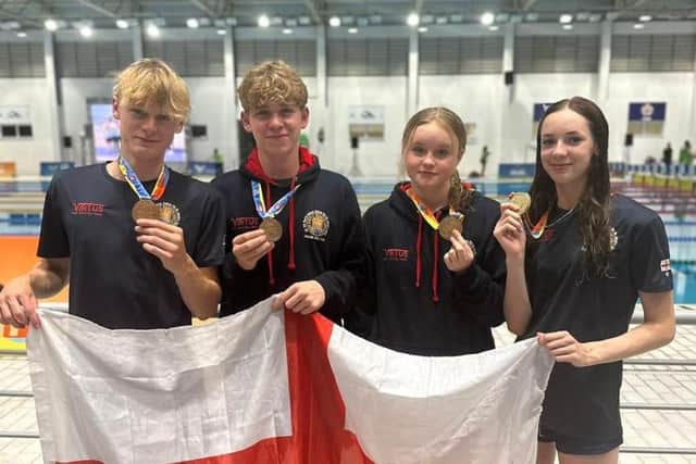 Proud member of the England team - Harrogate Grammar School's Gabe Shepherd, second from left, is now a world champion in swimming. Picture contributed)
