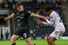 Tom Cursons made his professional debut during Harrogate Town's 2-1 defeat at MK Dons. Picture: Matt Kirkham