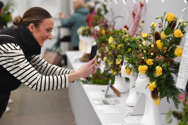 Visitors enjoying the gorgeous flower arrangements on display in the Floral Art marquee at the show