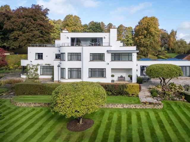 A full view of the 1930s home with three acres of grounds that include a tennis court, an annexe, and leisure complex.