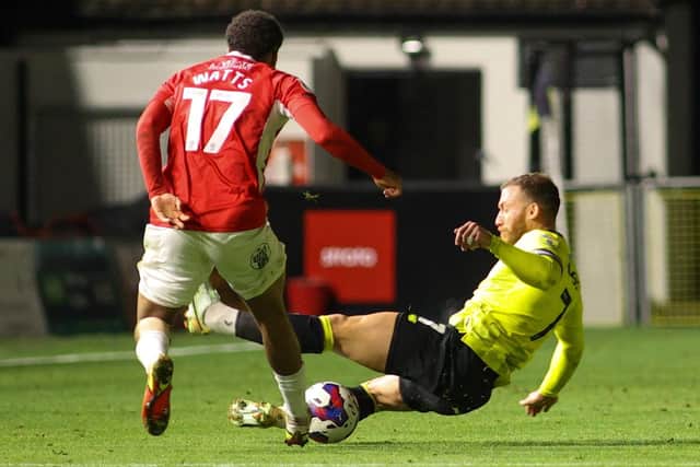George Thomson throws himself into a challenge during Harrogate Town's 2-1 victory over Morecambe in midweek.