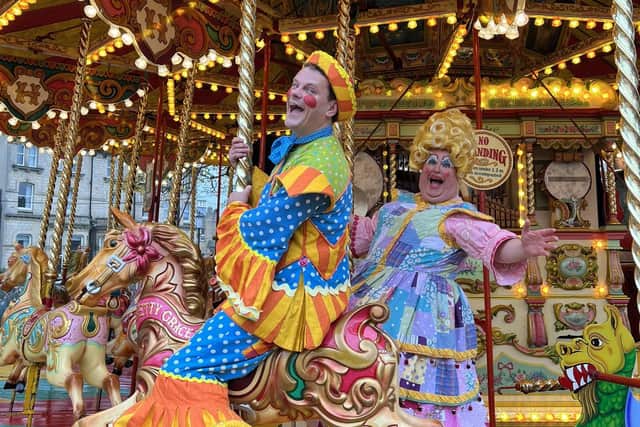 Wishee Washee (Tim Stedman) and Widow Twankey  (Howard Chadwick) took a spin on the traditional carousel in Crescent Gardens as Harrogate Christmas Fayre was launched. (Picture Tori Moor)