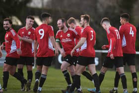 Knaresborough Town's players celebrate after Philip Milsom (3) fired them into a first-half lead against Silsden. Pictures: Gerard Binks