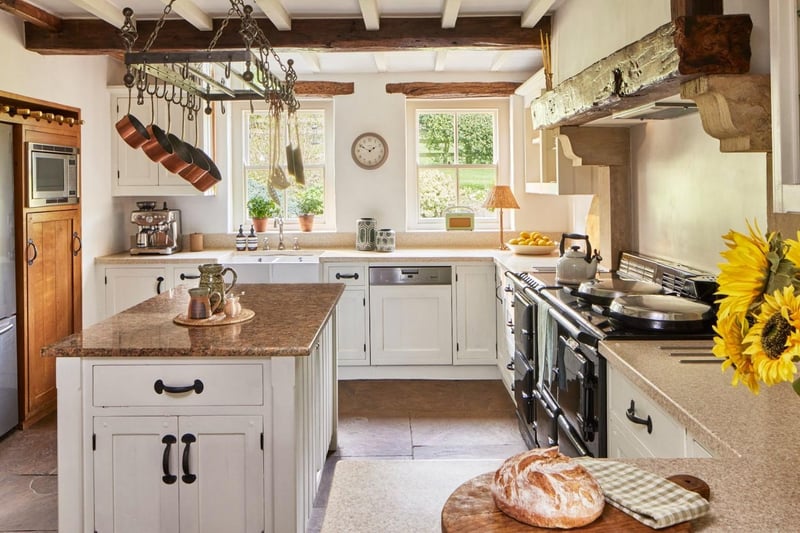 The kitchen and dining space features an Aga cooker