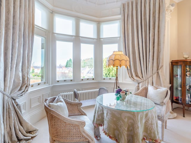 A large bay window reveals gorgeous views.