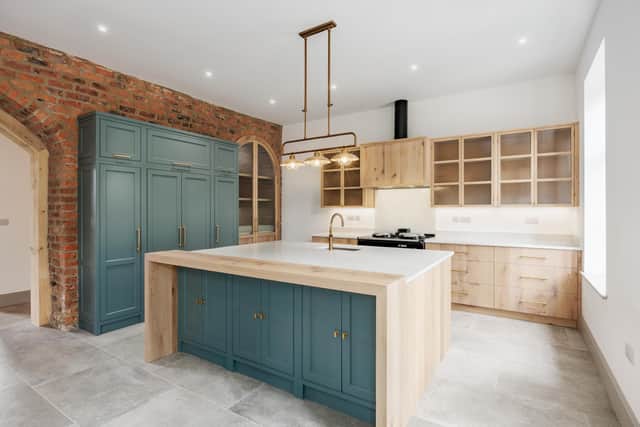 Contemporary style with original brickwork and archway in the kitchen in The Grain House.
