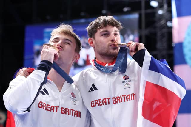 Bronze medallists Jack Laugher, left, and Anthony Harding of Team Great Britain pose following the diving medal ceremony after the men's synchronised 3m springboard final on day seven of the Olympic Games Paris 2024 at the Aquatics Centre. Photo by Quinn Rooney/Getty Images