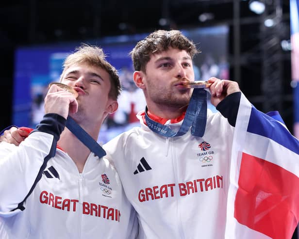 Bronze medallists Jack Laugher, left, and Anthony Harding of Team Great Britain pose following the diving medal ceremony after the men's synchronised 3m springboard final on day seven of the Olympic Games Paris 2024 at the Aquatics Centre. Photo by Quinn Rooney/Getty Images
