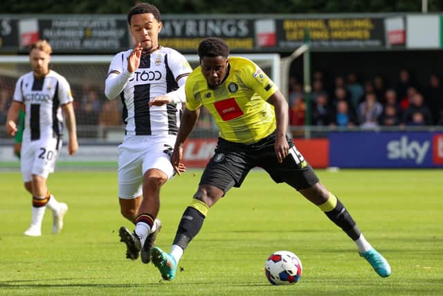 Jaheim Headley in action during Harrogate Town's Yorkshire derby defeat to Bradford City at Wetherby Road.