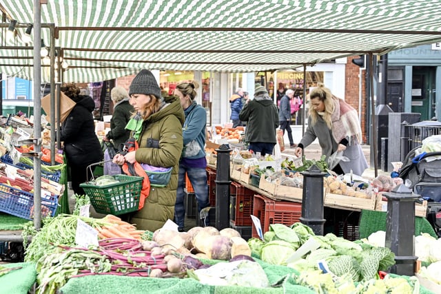 The fresh fruit and vegetable stalls attract regular shoppers who live and work in the city