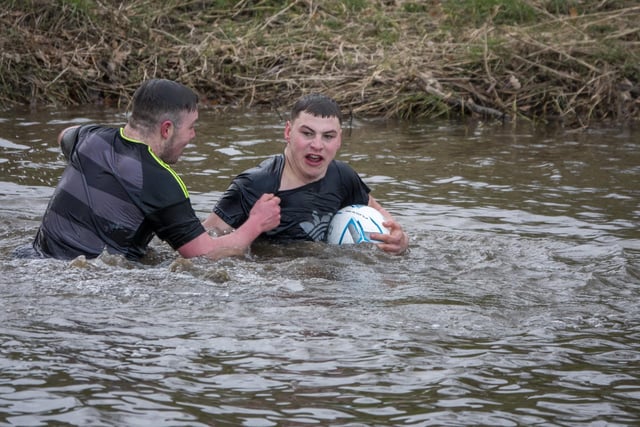 Will McDougall got the match ball over the River Aln after the Alnwick Shrove Tuesday football match.
