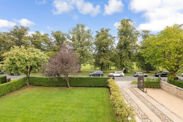 Set within enclosed gardens, the property has a large lawn to the front, flowering borders and a mature boundary hedging