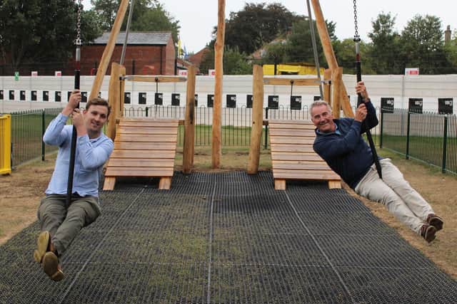 Councillor Sam Gibbs and Councillor Phil Ireland enjoying the new zip-wire that has opened in Knaresborough