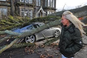 Zenya Dunne surveys the damage to her partner's Porsche 911