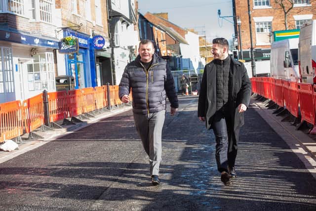 Councillor Andrew Williams (left) and Councillor Keane Duncan assessing the final stage of the resurfacing and lining work on the roads around Ripon Market Place
