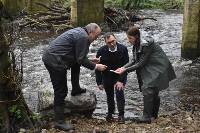 Seeing the scale of the problem - Tom Gordon, Liberal Democrat parliamentary spokesperson for Harrogate and Knaresborough, centre, with Lib Dem leader Ed Davey MP and Coun Hannah Gostlow, who represents Knaresborough East at North Yorkshire County Council, testing water samples at the Nidd last month. (Picture contributed)