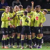 Harrogate Town players celebrate after Luke Armstrong, third left, netted a first-half equaliser against Carlisle United in midweek. Pictures: Matt Kirkham