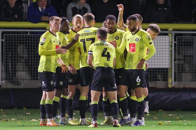 Harrogate Town players celebrate after Luke Armstrong, third left, netted a first-half equaliser against Carlisle United in midweek. Pictures: Matt Kirkham
