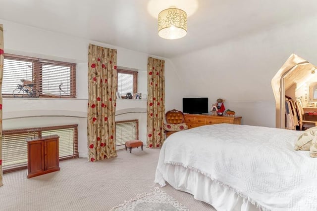 A stunning double bedroom, with dressing room leading off.