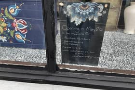 A blackboard in the empty retail unit in Harrogate says the new cafe will be opening in May. (Picture contributed)