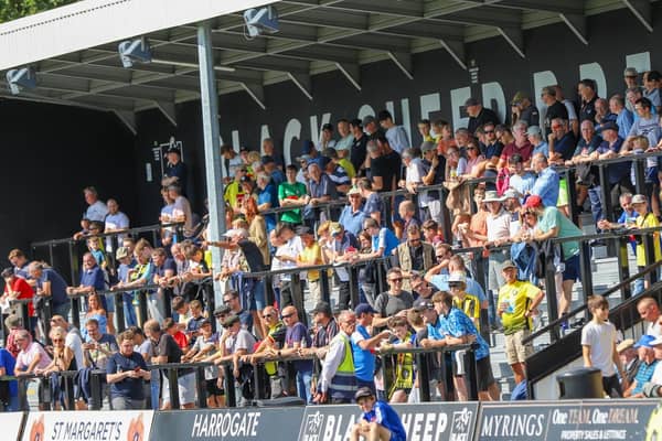 Harrogate Town supporters inside the EnviroVent Stadium. Pictures: Matt Kirkham