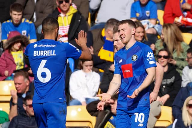 Matty Daly is congratulated after breaking the deadlock in Good Friday's League Two clash.