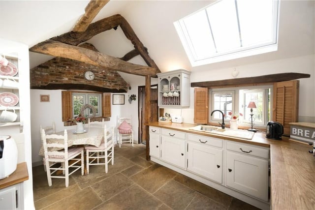 The light and spacious breakfast kitchen has stunning views from its windows.