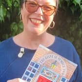Illustrator Helen Morgan with a copy of 'The Giant at Number Two'