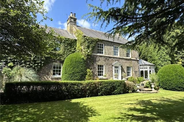 A view of the picturesque village home from its gardens.
