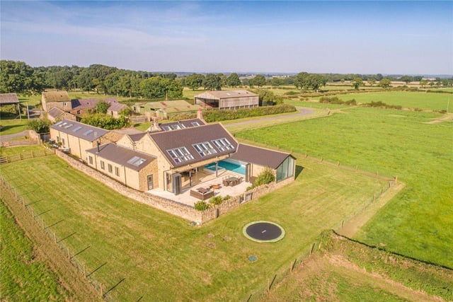 This eight bedroom and five bathroom detached house is for sale with Strutt & Parker for £3,000,000