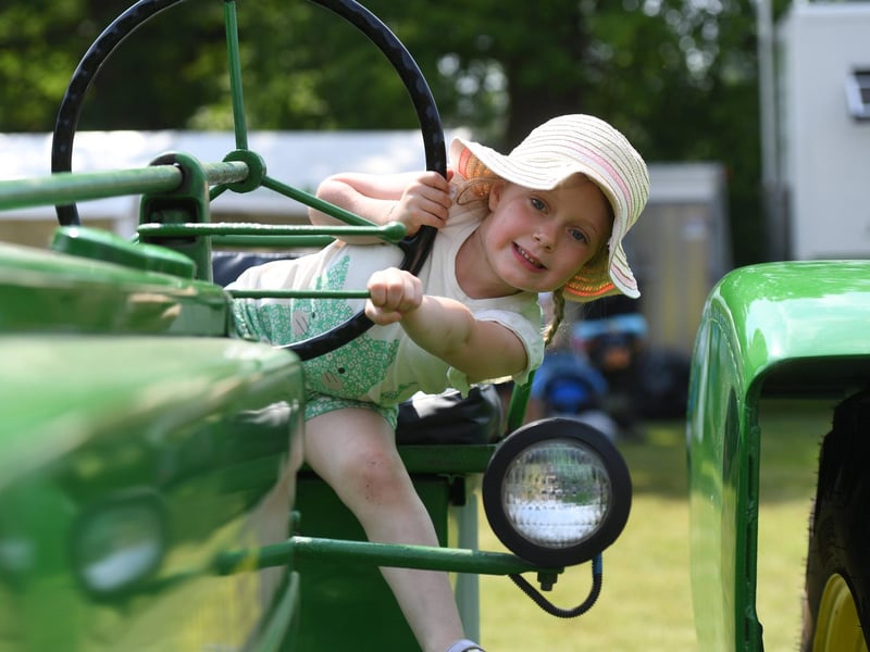 Annabelle Willis (aged four) sat on a John Deere Tractor