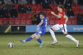 Jack Muldoon slots the ball home to hand Harrogate Town a 50th-minute lead against Salford City on Tuesday evening. Pictures: Paul Thompson/ProSportsImages