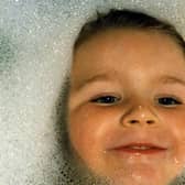 30 Years video - A photograph of Cory McLeod from Starbeck in the bath as a toddler one of the thouands of images taken of him by his father Ian.