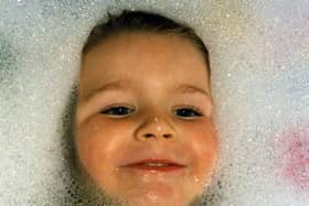 30 Years video - A photograph of Cory McLeod from Starbeck in the bath as a toddler one of the thouands of images taken of him by his father Ian.