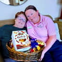 Josie (left) a resident at Boroughbridge Manor and Leann  (right) home activities team with some of the donated treats