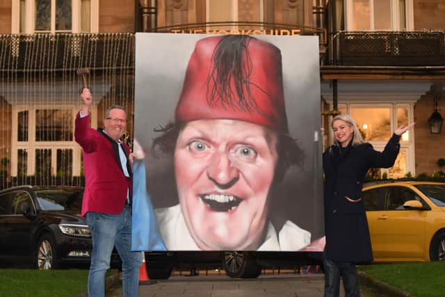 Looking forward to Charity Love Ball at Rudding Park in Harrogate - Organiser Alice Maguire with MC Simon Cotton who will be helping to raise money in aid of Martin House Children’s Hospice with the help of Temper's portrait of Tommy Cooper. (Picture Gerard Binks)