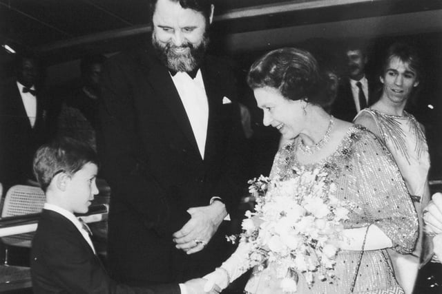 The Queen shakes hands with eight year old Brendan Woith, who was flown from his home in Adelaide, Australia, for the Harrogate Gala Show in 1985