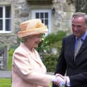 Visiting the set of Emmerdale in 2002. The Queen and Duke of Edinburgh's visit to Harewood House and the Emmerdale set. The Queen meets Emmerdale actor Chris Chittell, right, and Emmerdale Line Producer Tim Fee.