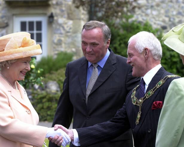 Visiting the set of Emmerdale in 2002. The Queen and Duke of Edinburgh's visit to Harewood House and the Emmerdale set. The Queen meets Emmerdale actor Chris Chittell, right, and Emmerdale Line Producer Tim Fee.