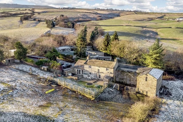 This three bedroom two bathroom property has stunning views and barn conversion development potential and 12 acres of land. For sale with Strutt & Parker - Harrogate, at the guide price of £900,000