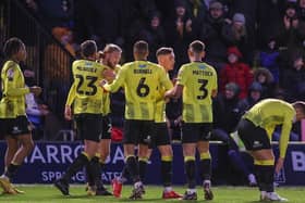 Luke Armstrong takes the congratulations of his Harrogate Town team-mates after netting a second-half equaliser against Stevenage. Pictures: Matt Kirkham