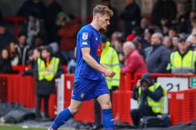 Toby Sims heads off the pitch having been shown a red card late on in Harrogate Town's 3-1 League Two defeat at Crawley. Pictures: Matt Kirkham