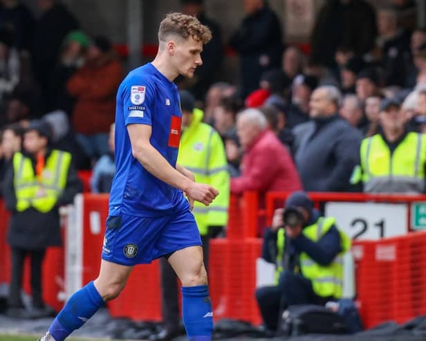 Toby Sims heads off the pitch having been shown a red card late on in Harrogate Town's 3-1 League Two defeat at Crawley. Pictures: Matt Kirkham